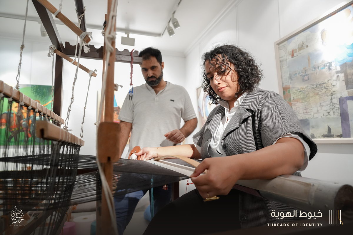 Marie Joubert and Tamadher AlFahal at the loom
