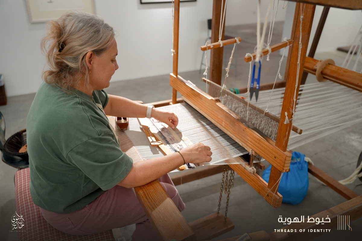 Marie Joubert and Tamadher AlFahal at the loom