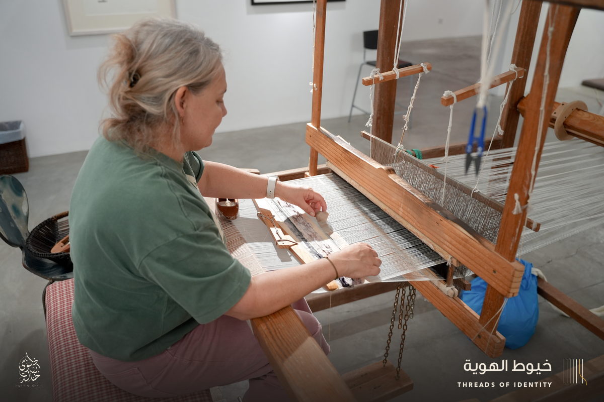 Marie Joubert and Tamadher AlFahal at the loom