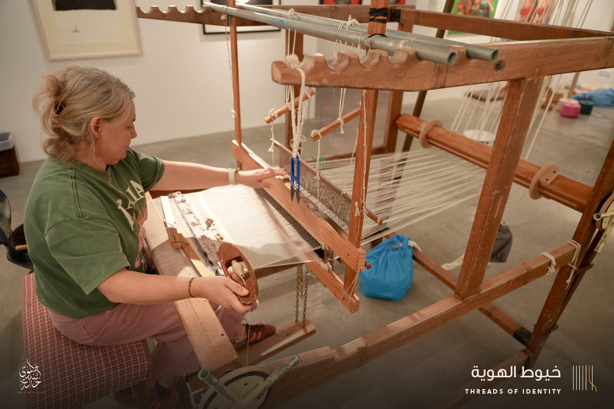 Marie Joubert and Tamadher AlFahal at the loom