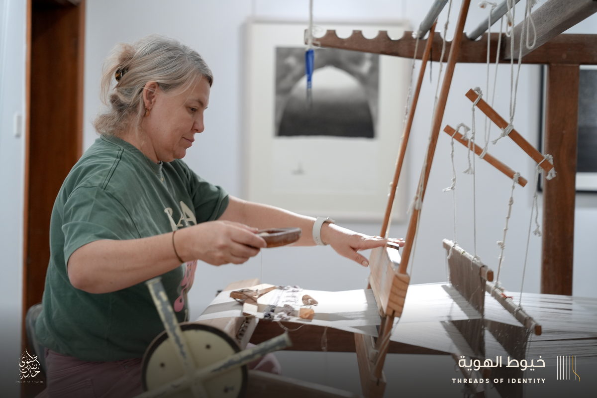 Marie Joubert and Tamadher AlFahal at the loom